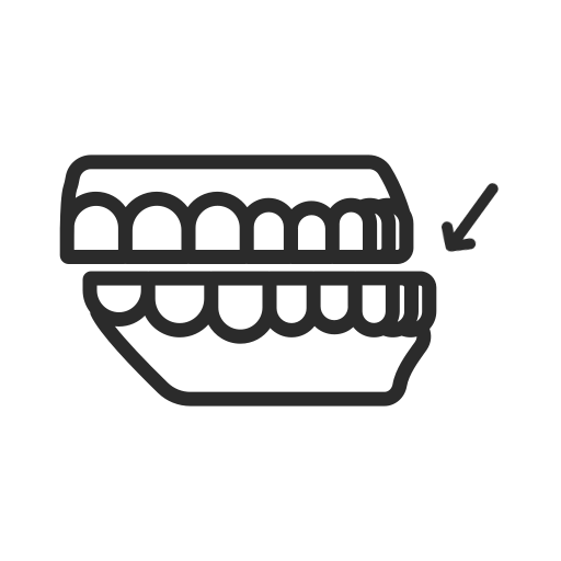 Dental dentures icon with arrow pointing